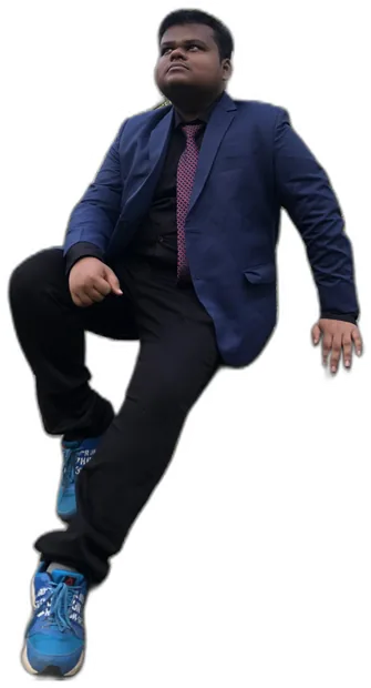Aditya in a blue suit, sitting as if on an invisible rock
